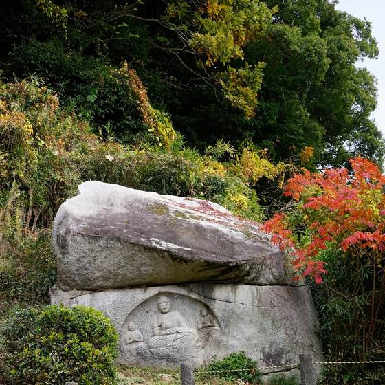 Amida triad cliff carving, known as the Laughing Buddhas