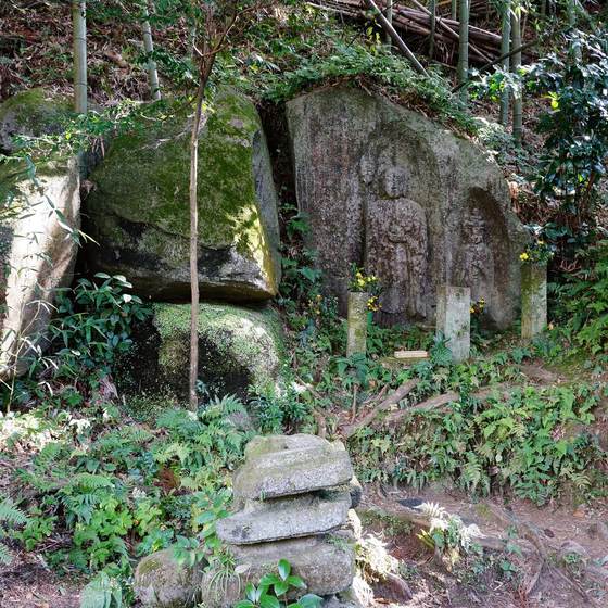 Triad in the Thicket cliff carving