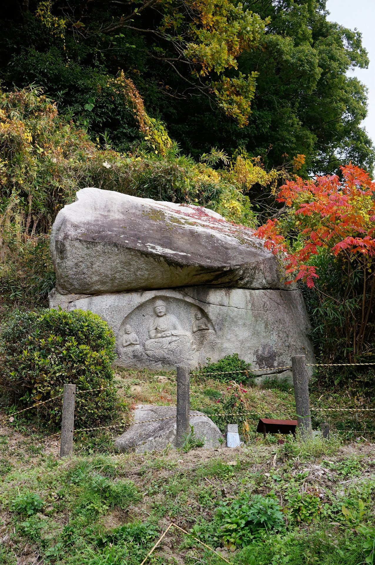 Amida triad cliff carving, known as the Laughing Buddhas
